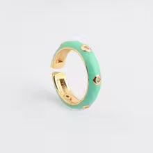 Gold ring with green band on a white background