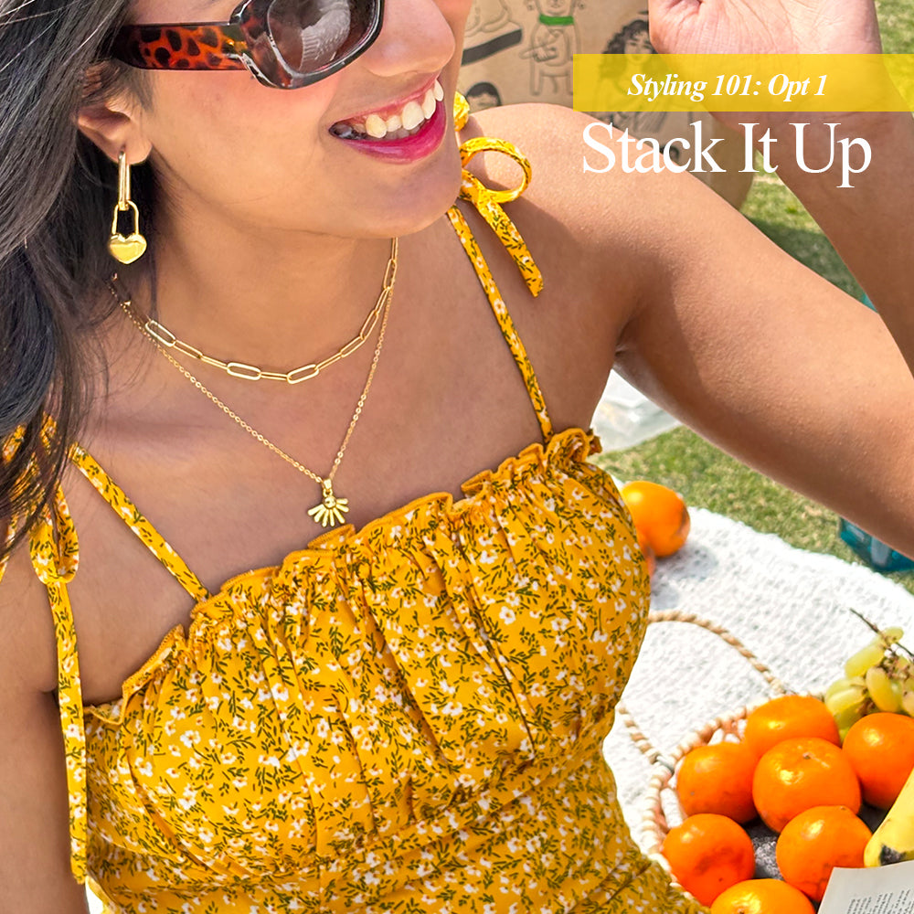 A gold-plated link chain necklace displayed on a different styling