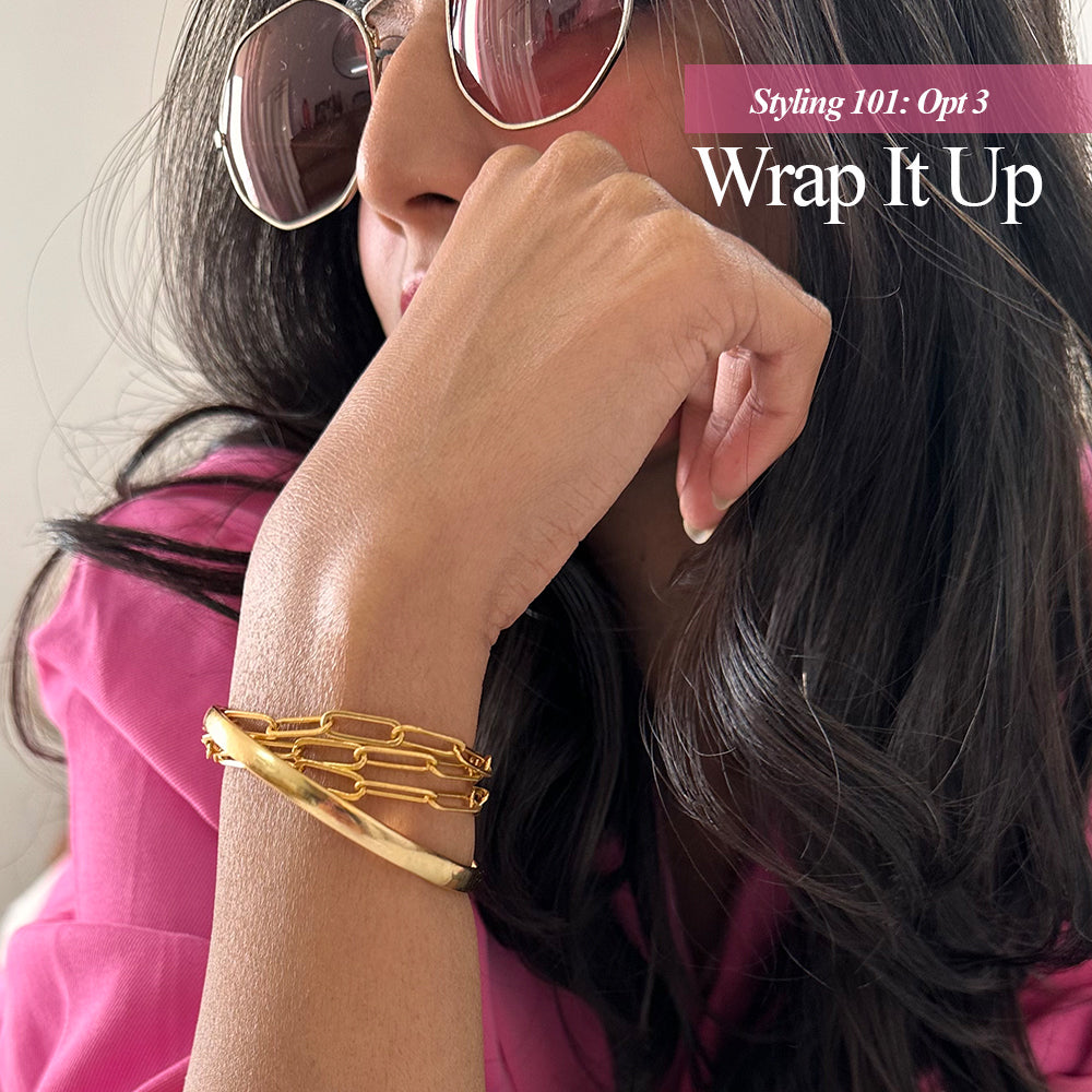 A gold-plated link chain necklace displayed on a different styling