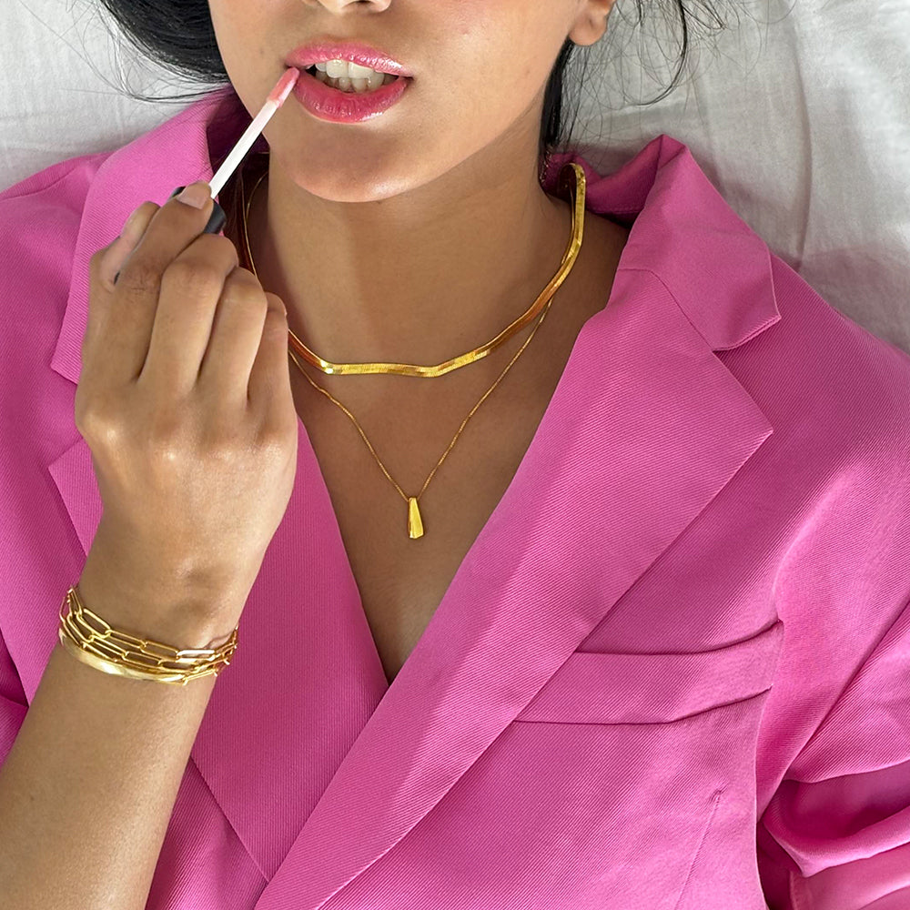 gold plated serpant chain displayed on a model
