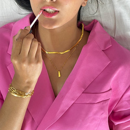 gold plated serpant chain displayed on a model
